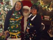 City Secretary Lauren Grayson, Santa, and Utilities Clerk Tiffany Lewis